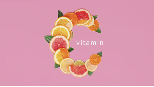 grapefruit and orange slices arranged to spell out the letter C